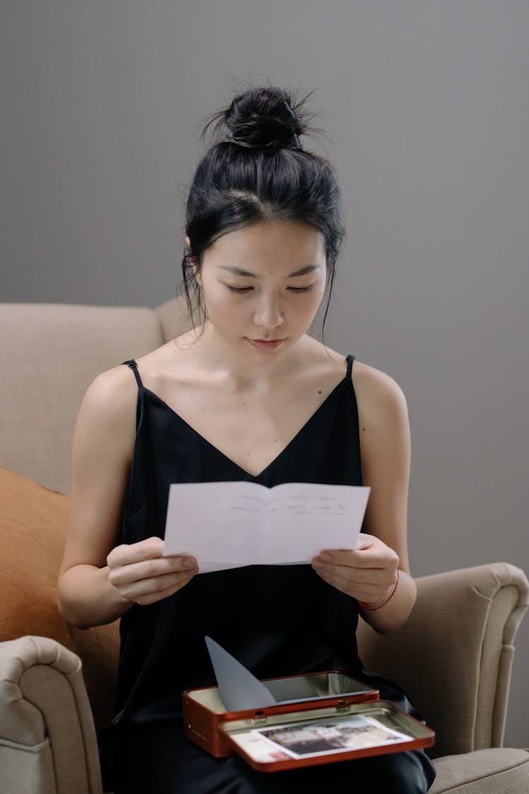 Woman In Black Spaghetti Strap Dress Reading A Letter 