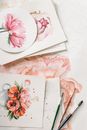 Pink and White Floral Ceramic Plate and Silver Fork on Pink Textile