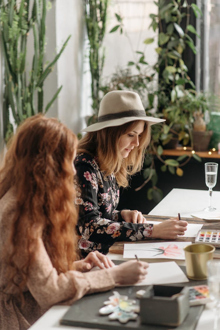 Women Drawing At The Table