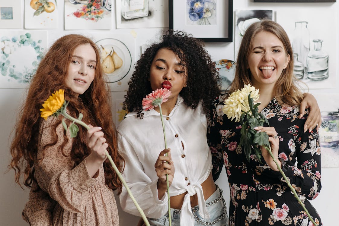 Free 3 Women Holding Flowers Stock Photo