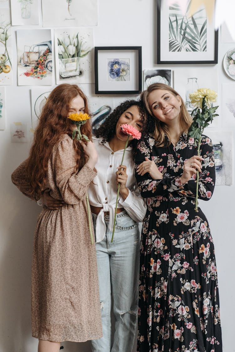 Women Holding Flowers