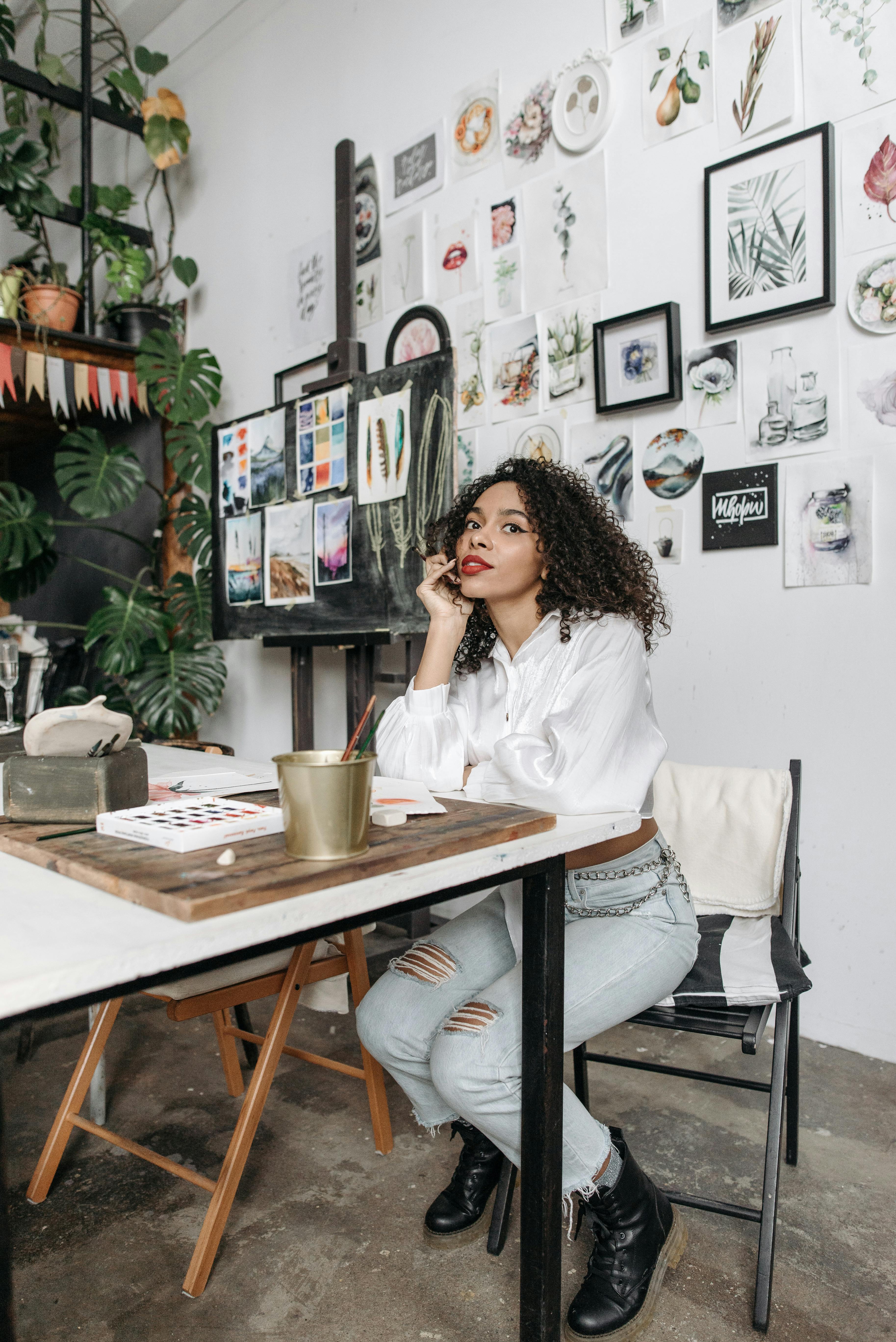 woman in white long sleeve shirt sitting on chair