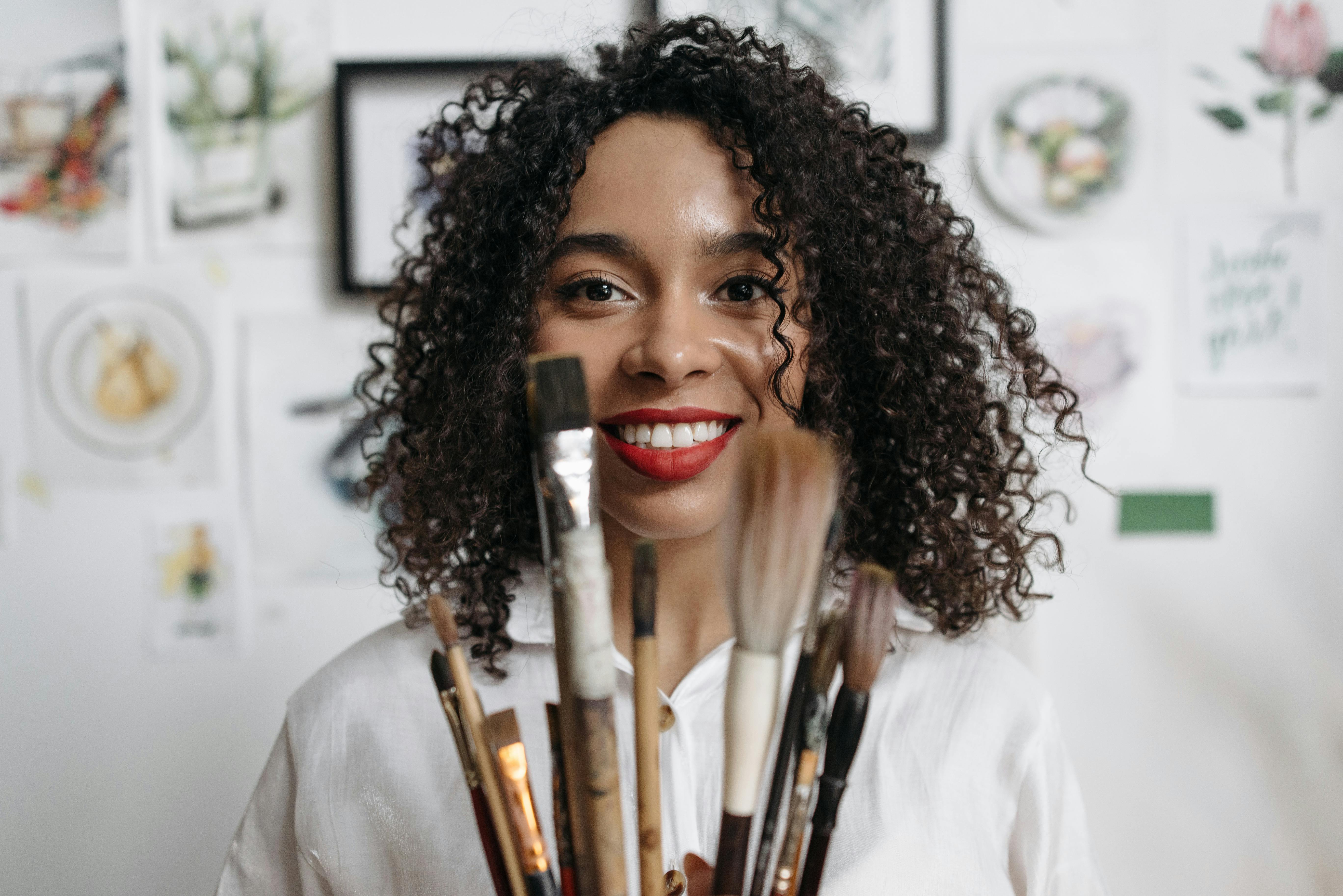 woman in white shirt with makeup brush