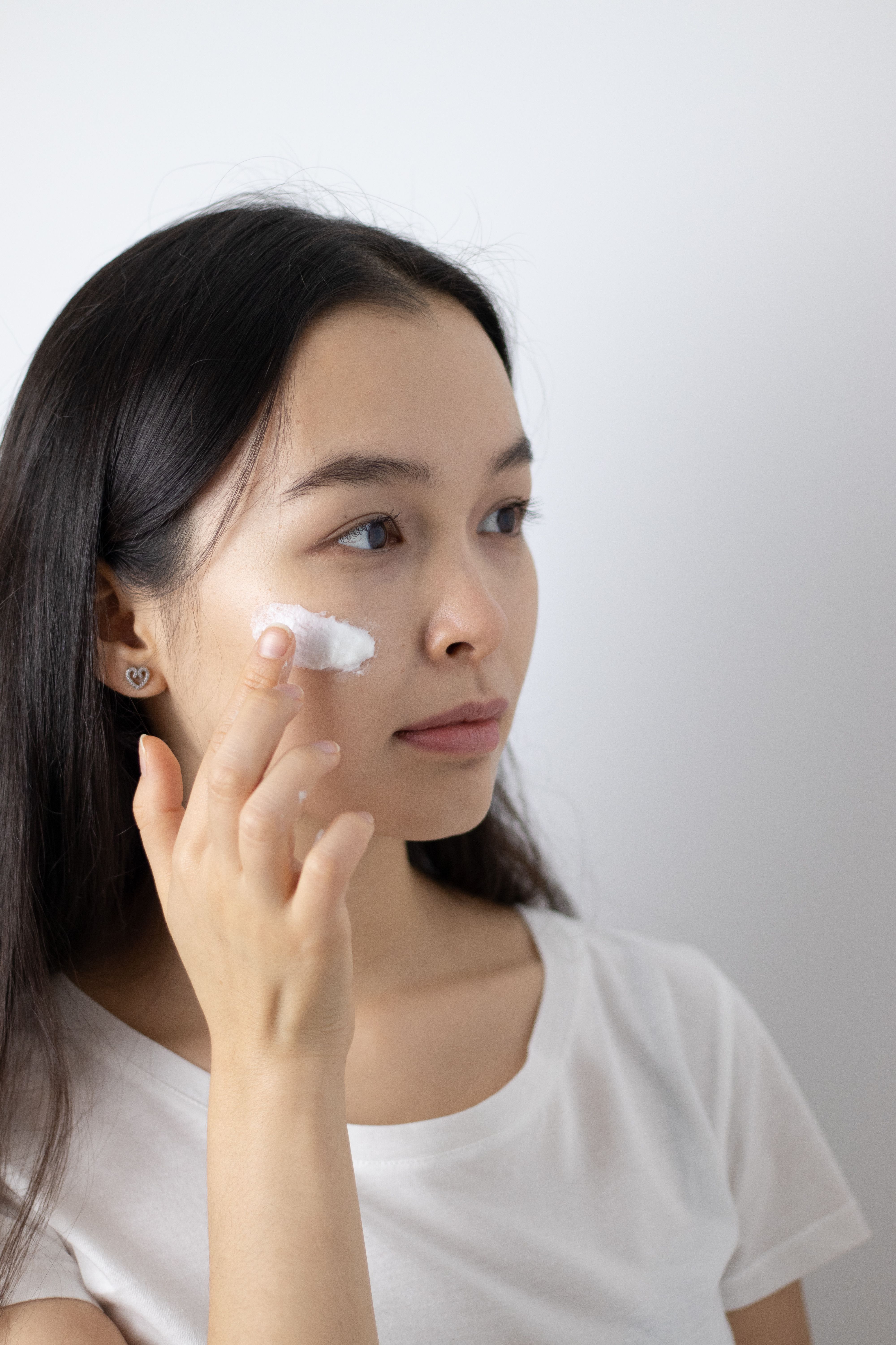 Young Man Applying Spray on Face · Free Stock Photo