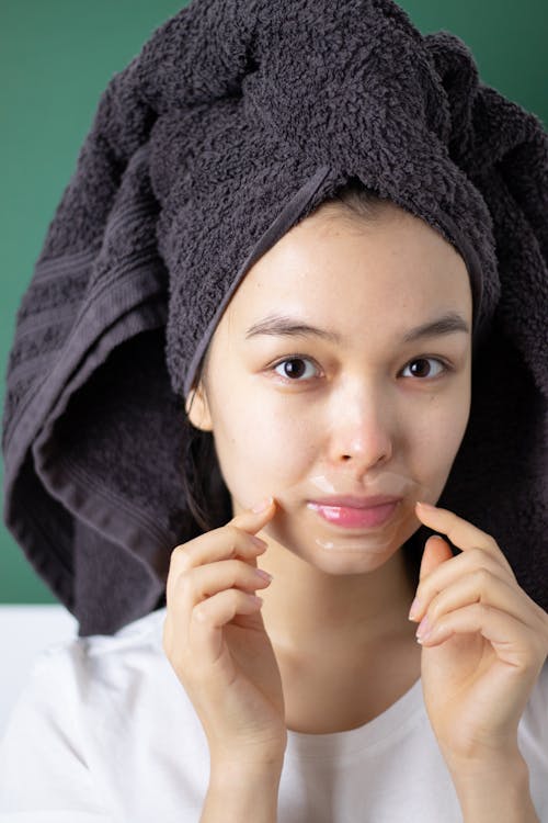 Woman With Head Towel and Lip Mask