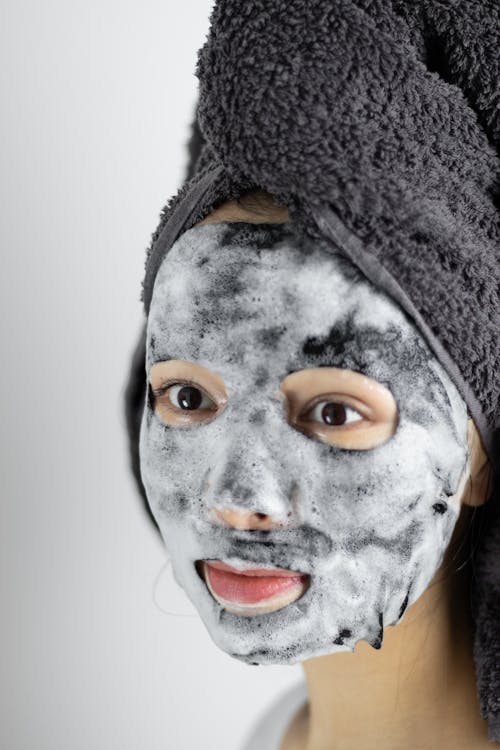Woman With Sheet Mask In Close Up View
