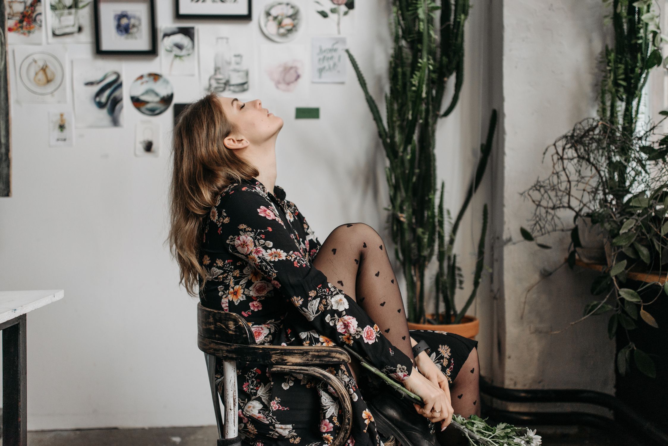 Woman in Black Floral Dress Sitting on a Chair · Free Stock Photo