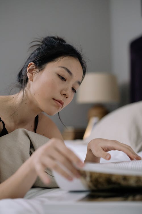 Attractive Woman Reading a Book