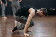 A Man Balancing his Body Using his Arms