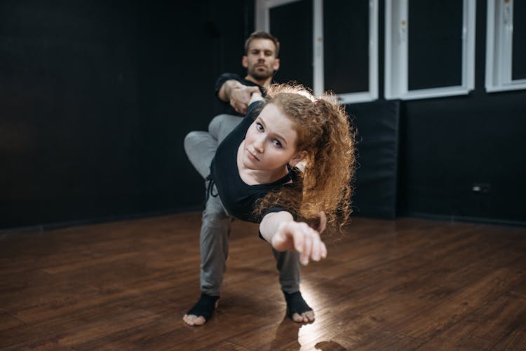 Couple Dancing Inside A Dance Studio