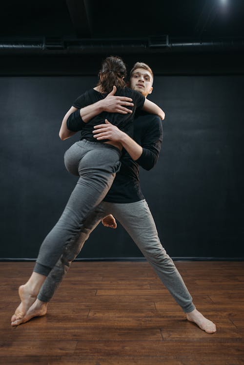 A Dancing Couple Embracing Each Other