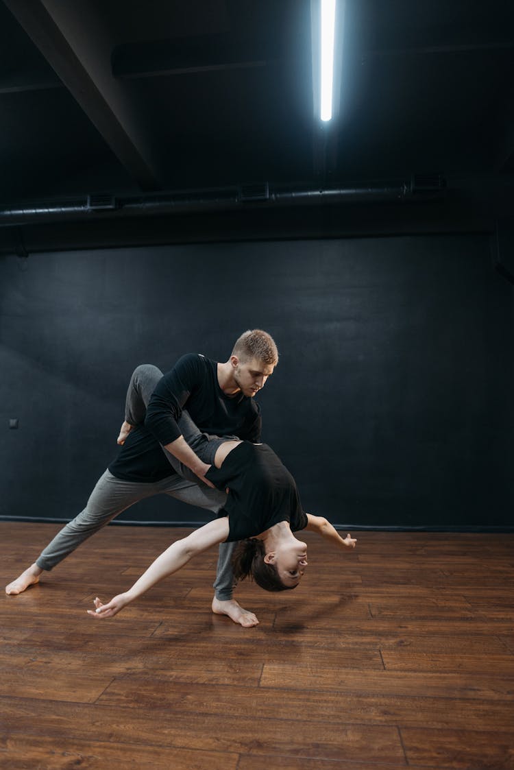 A Man And A Woman Dancing Together