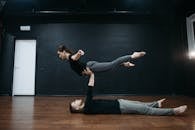 Man Carrying a Woman while Lying Down