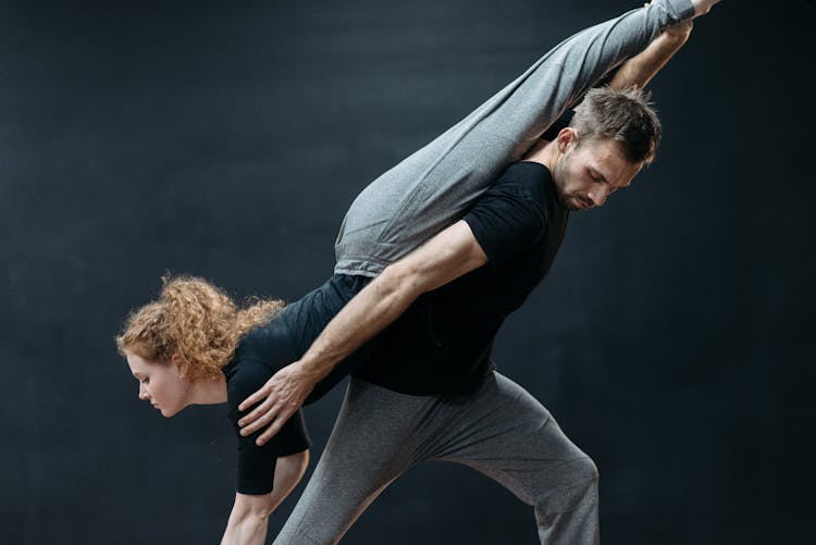 Man Carrying A Woman On His Back