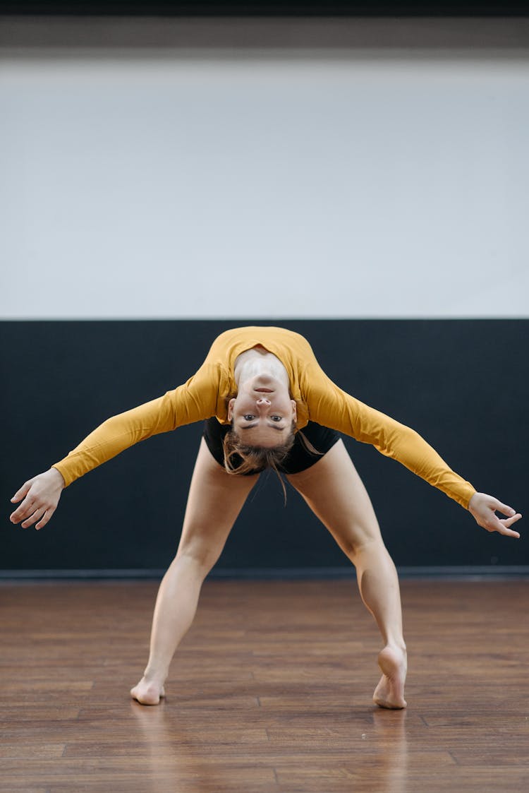 A Woman Bending Her Body Upside Down