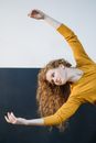 Woman in Dancing with Her Arms Raised