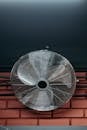 Ceiling Fan Beside a Brick Wall
