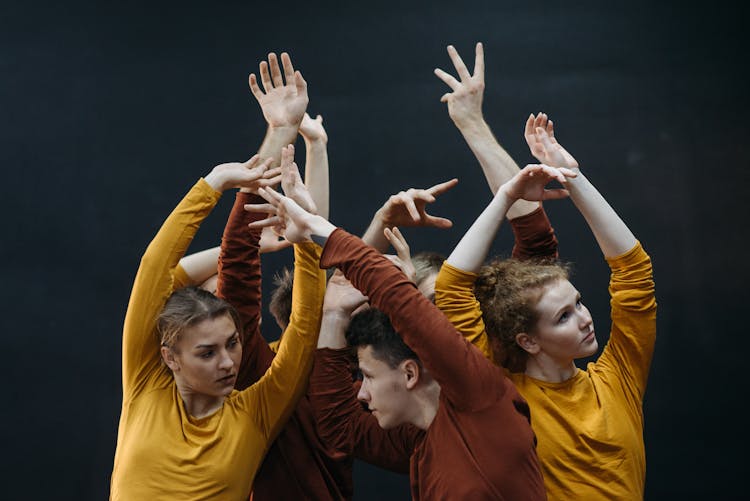 Group Of Beautiful People Dancing Together