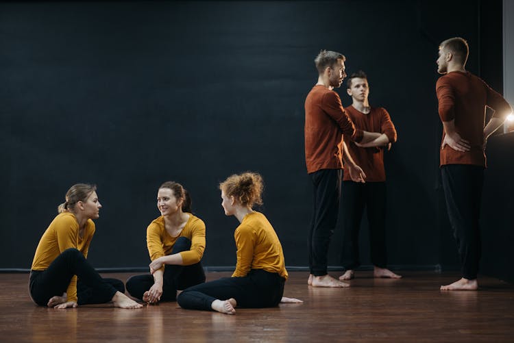 Group Of Women Sitting On The Floor