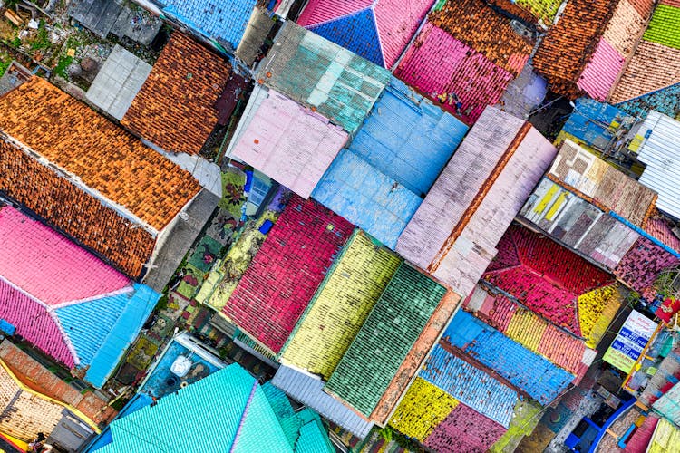 Aerial Shot Of Houses With Colorful Roofs 