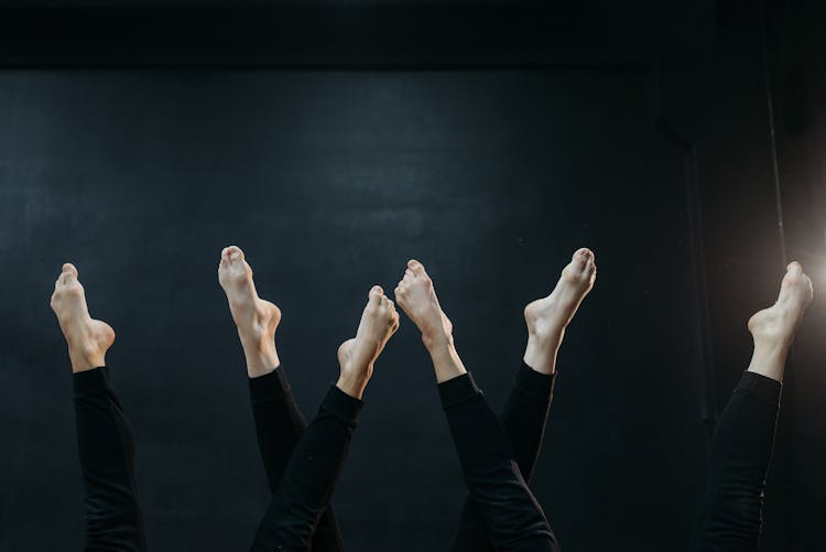 Girls Dancing With Their Legs Up