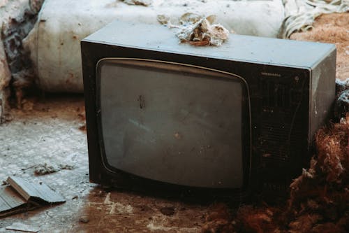 Close-Up Shot of a Shabby CRT Television