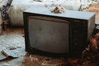 Close-Up Shot of a Shabby CRT Television