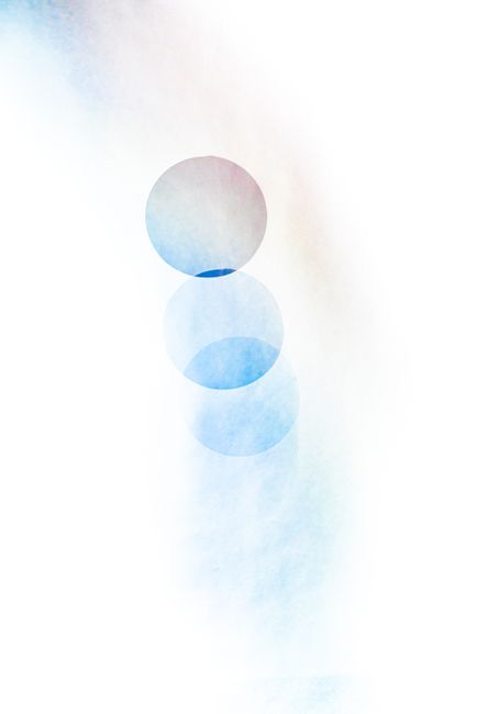 A soothing abstract image featuring overlapping pastel circles on a white background.