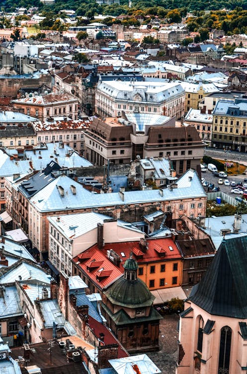 Free Picturesque drone view of Lviv cityscape with aged residential and historic buildings on sunny day Stock Photo