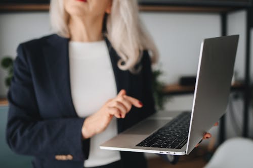 A Woman Holding Her Laptop