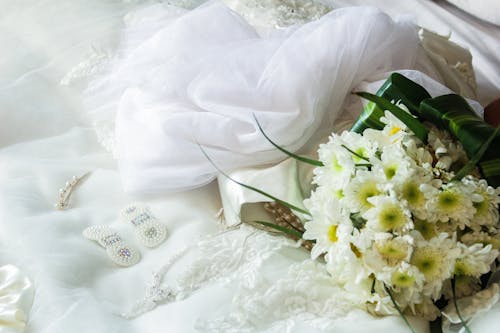 A Bouquet of Chrysanthemum Flowers Near the White Veil