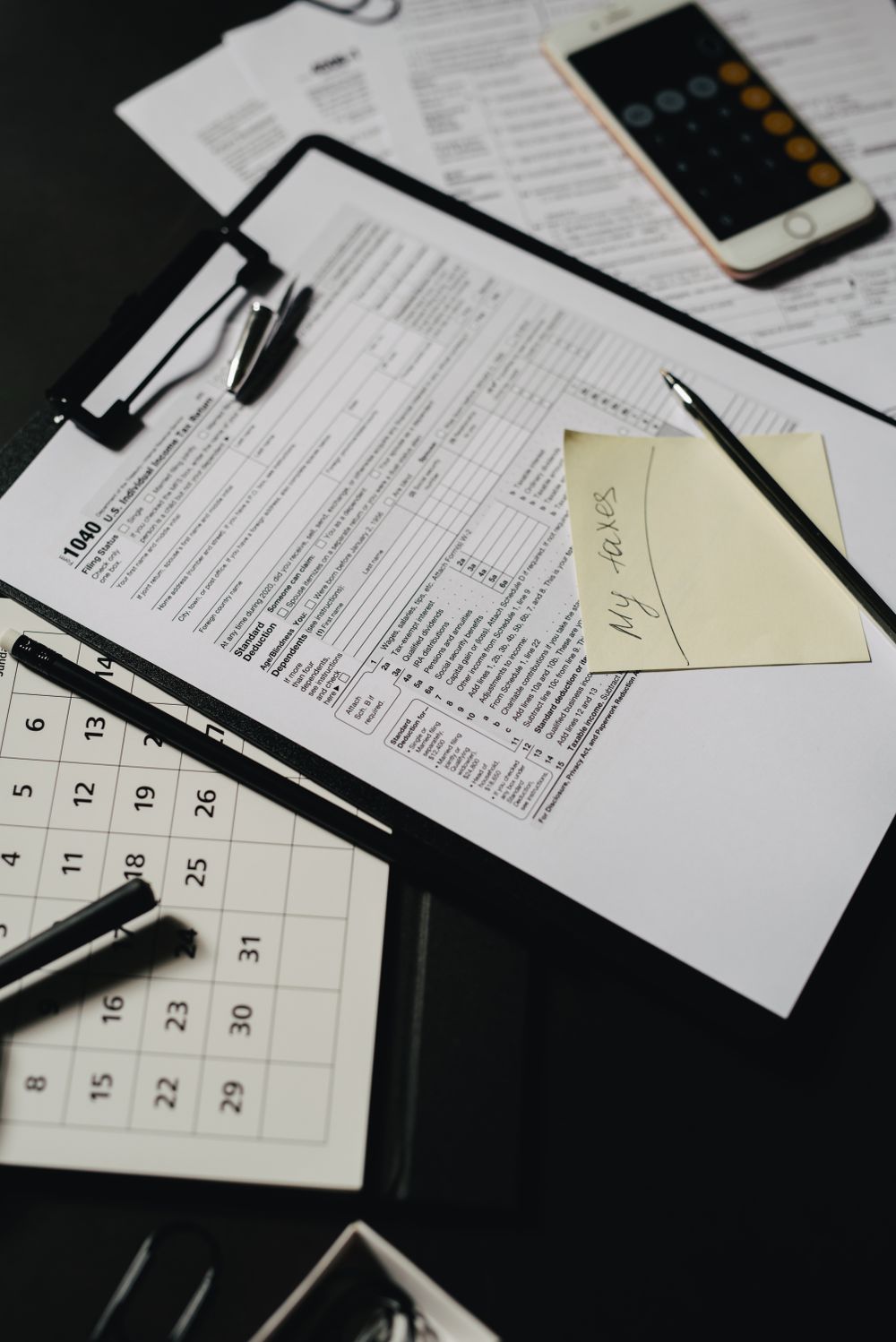 Estate planning paperwork and documents arranged on a desk