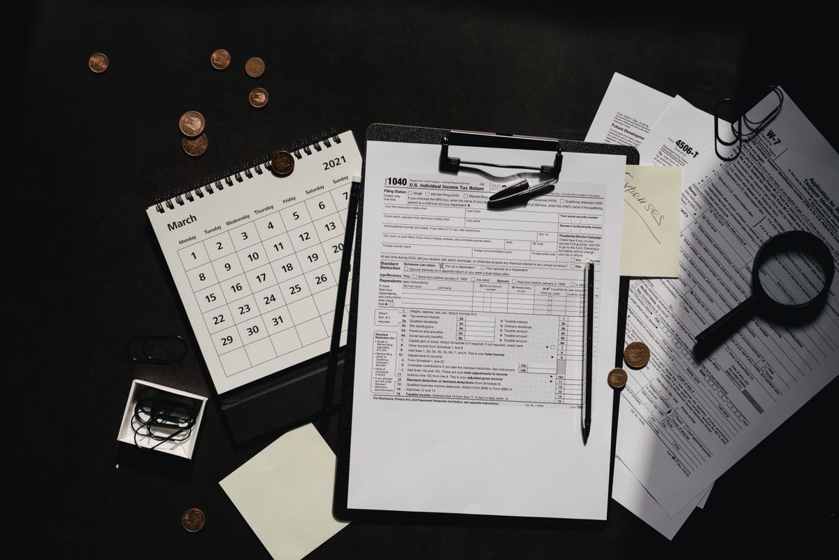 Organized tax documents and calendar for resolving back taxes in Dallas