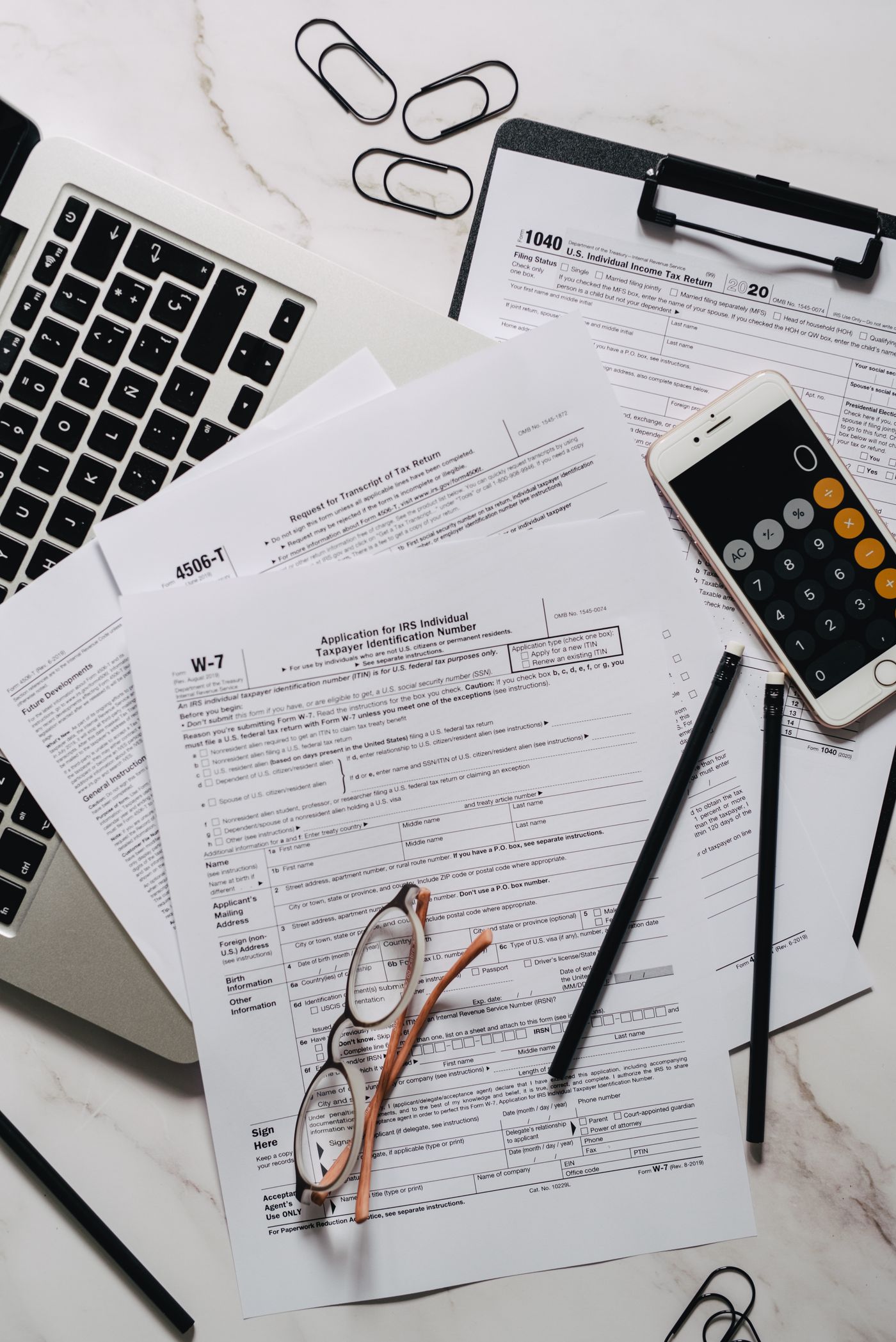 Tax forms, calculator and business financial records