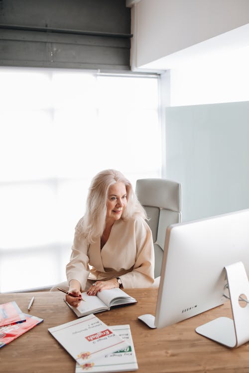 Woman Writing on Her Notebook