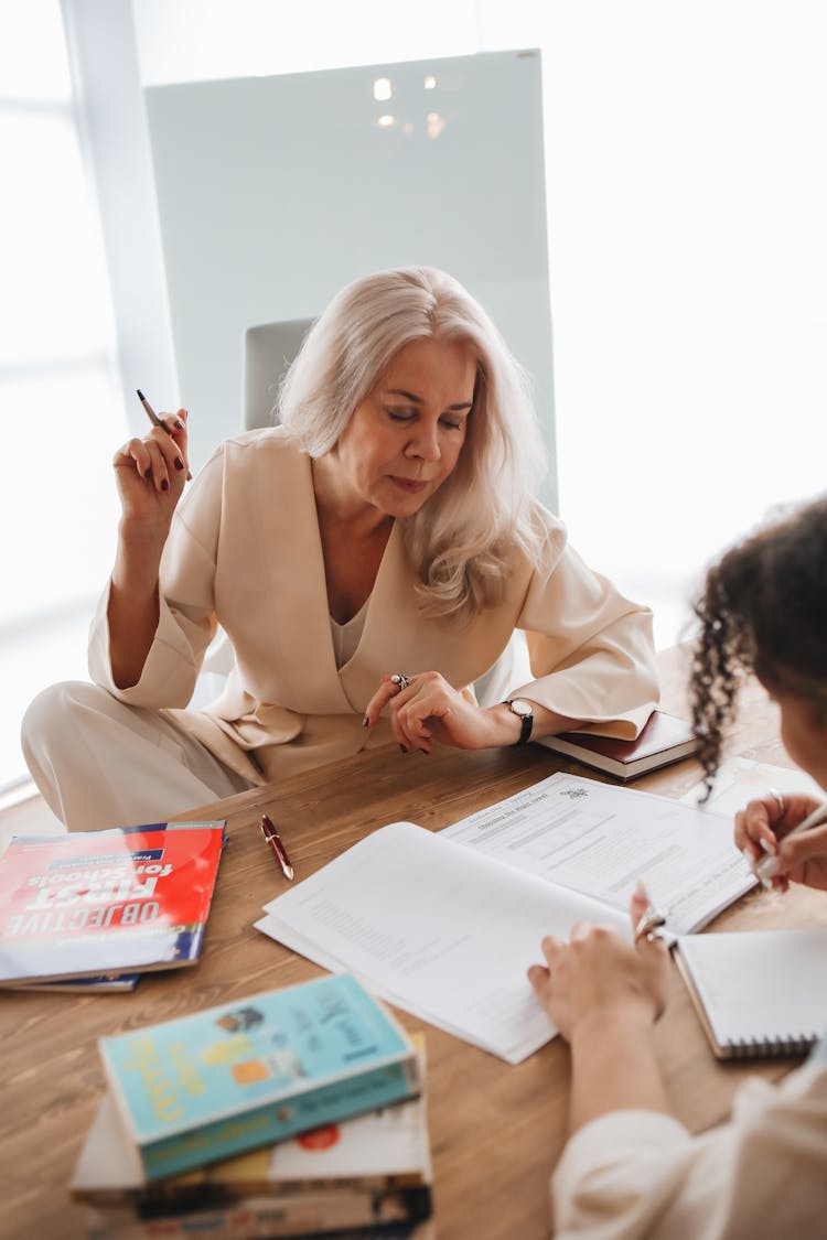 Teacher Discussing Her Lesson With Her Student