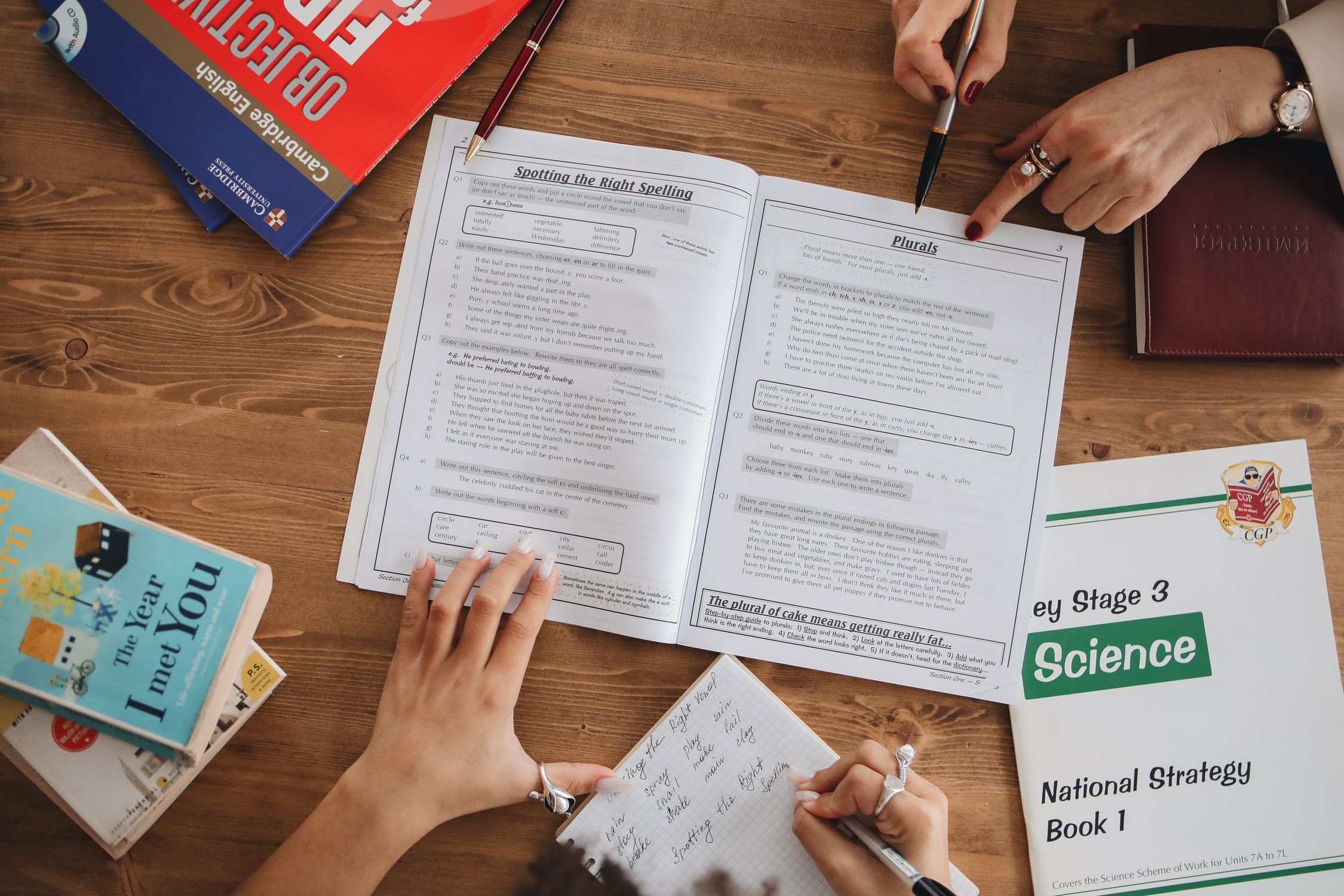 Person Writing Notes on Her Notebook · Free Stock Photo