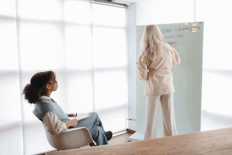 Teacher Discussing Her Lesson With Her Student