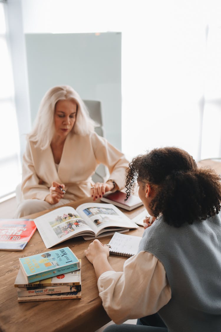 Teacher Discussing Her Lesson With Her Student