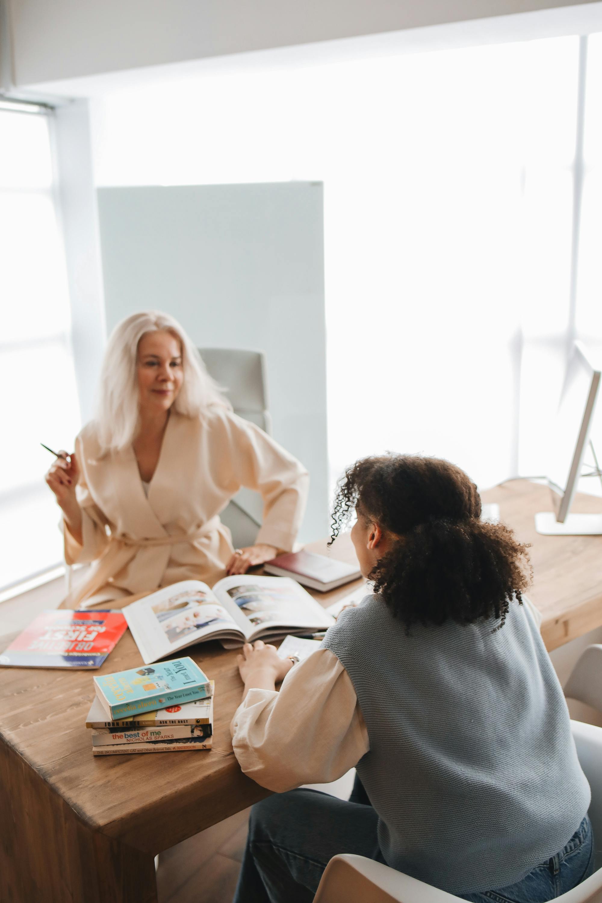 teacher discussing her lesson with her student