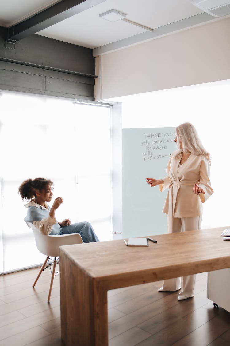 Teacher Discussing Her Lesson With Her Student