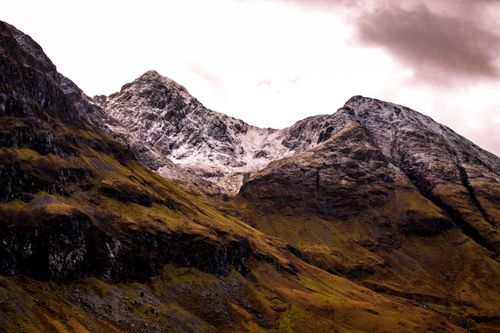 Free Breathtaking view of snow-capped mountain peaks in Glencoe, Scotland. Stock Photo