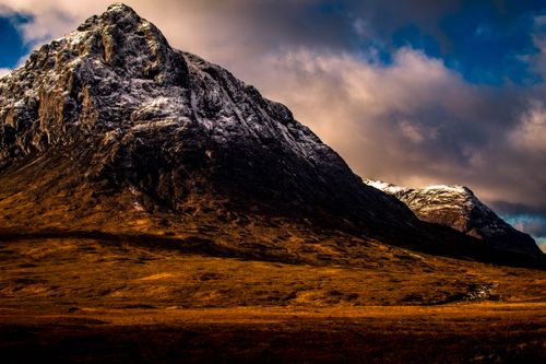 Free Stunning view of Buachaille Etive Mòr with a dramatic sky in Glencoe, Scotland. Stock Photo