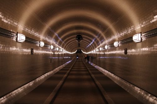 Free A mesmerizing view inside the iconic Elbe Tunnel in Hamburg, Germany, with people walking through. Stock Photo