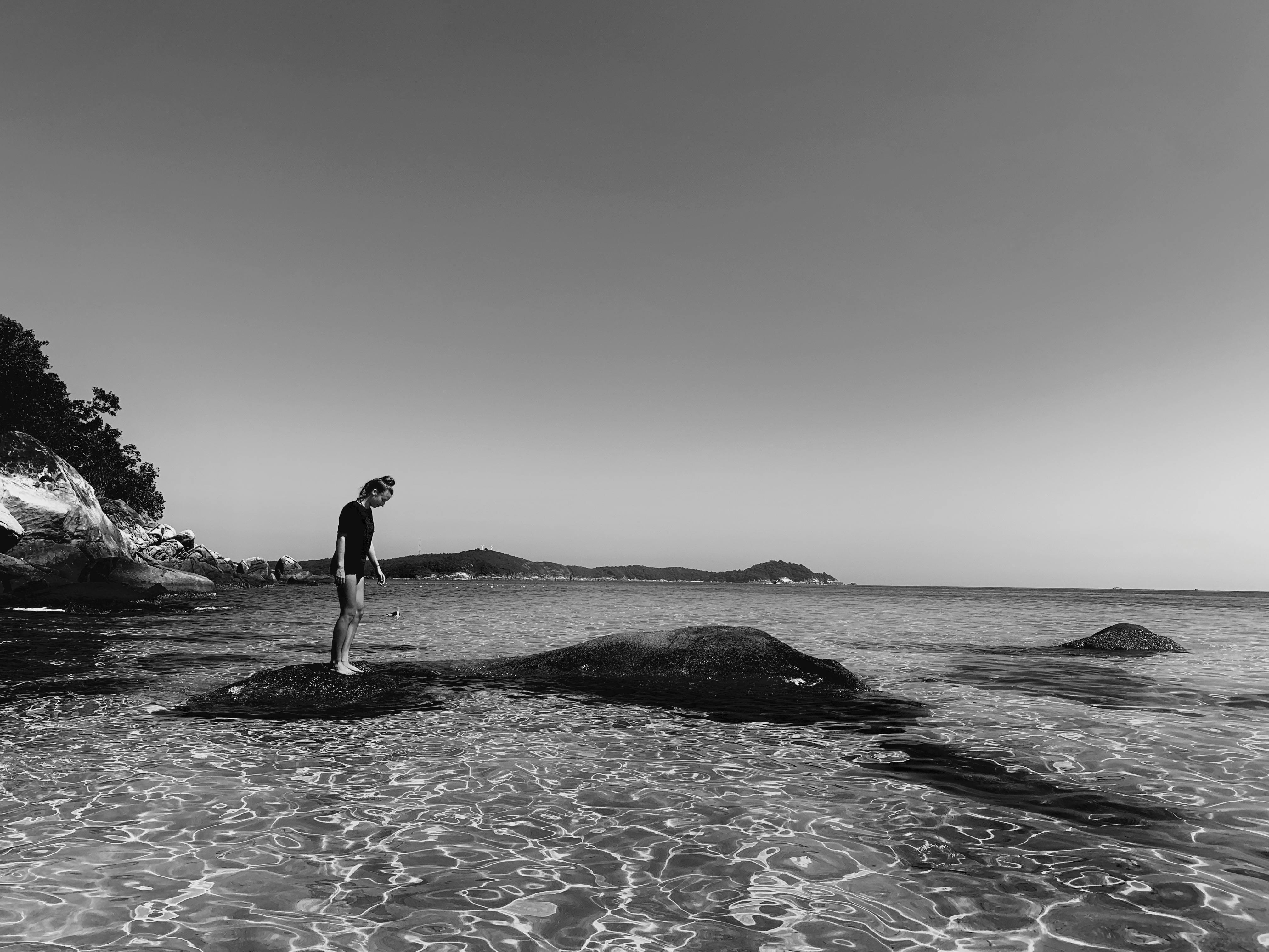 Person Standing on Rock · Free Stock Photo