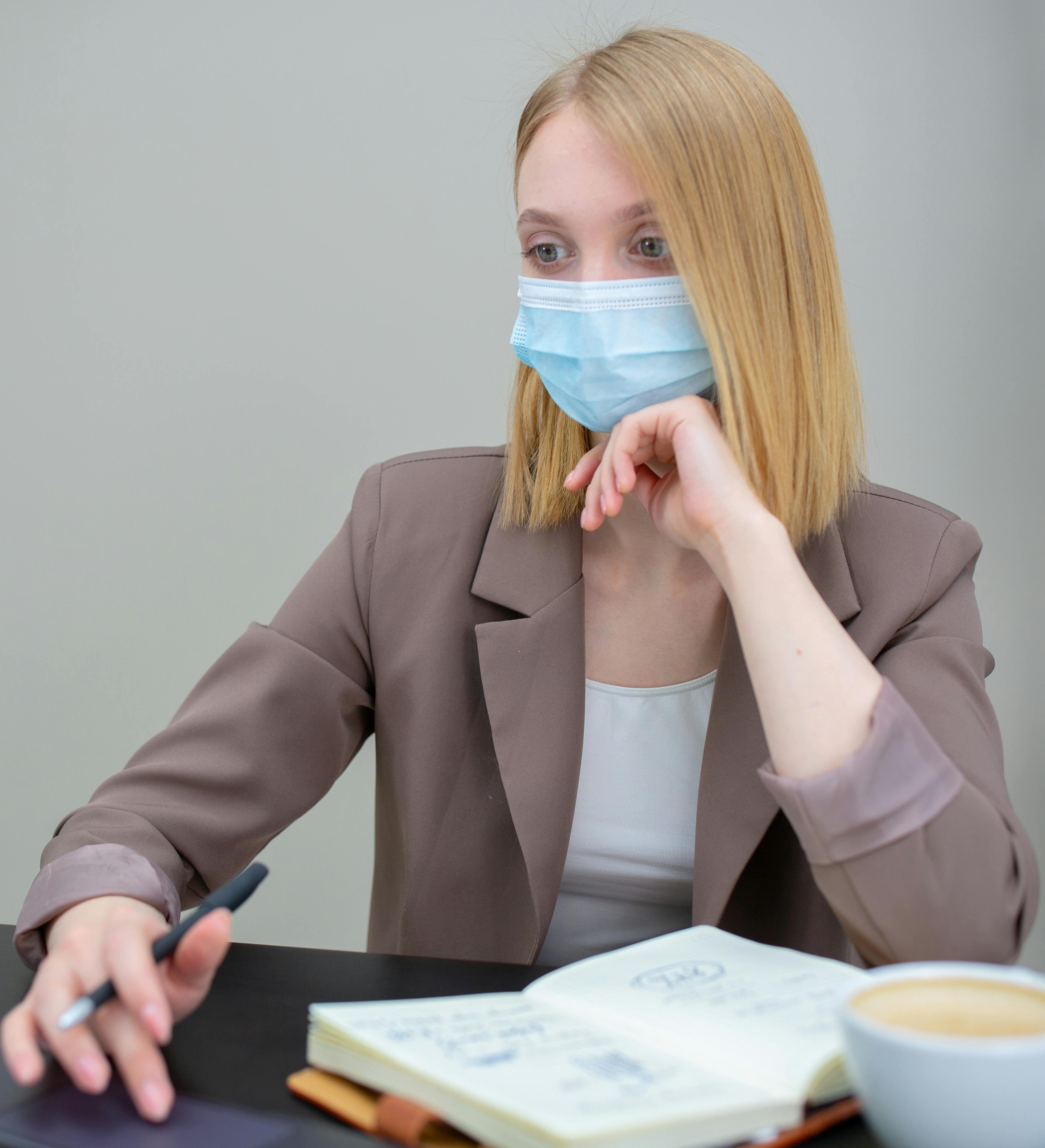 Woman in Brown Blazer with a Face Mask · Free Stock Photo