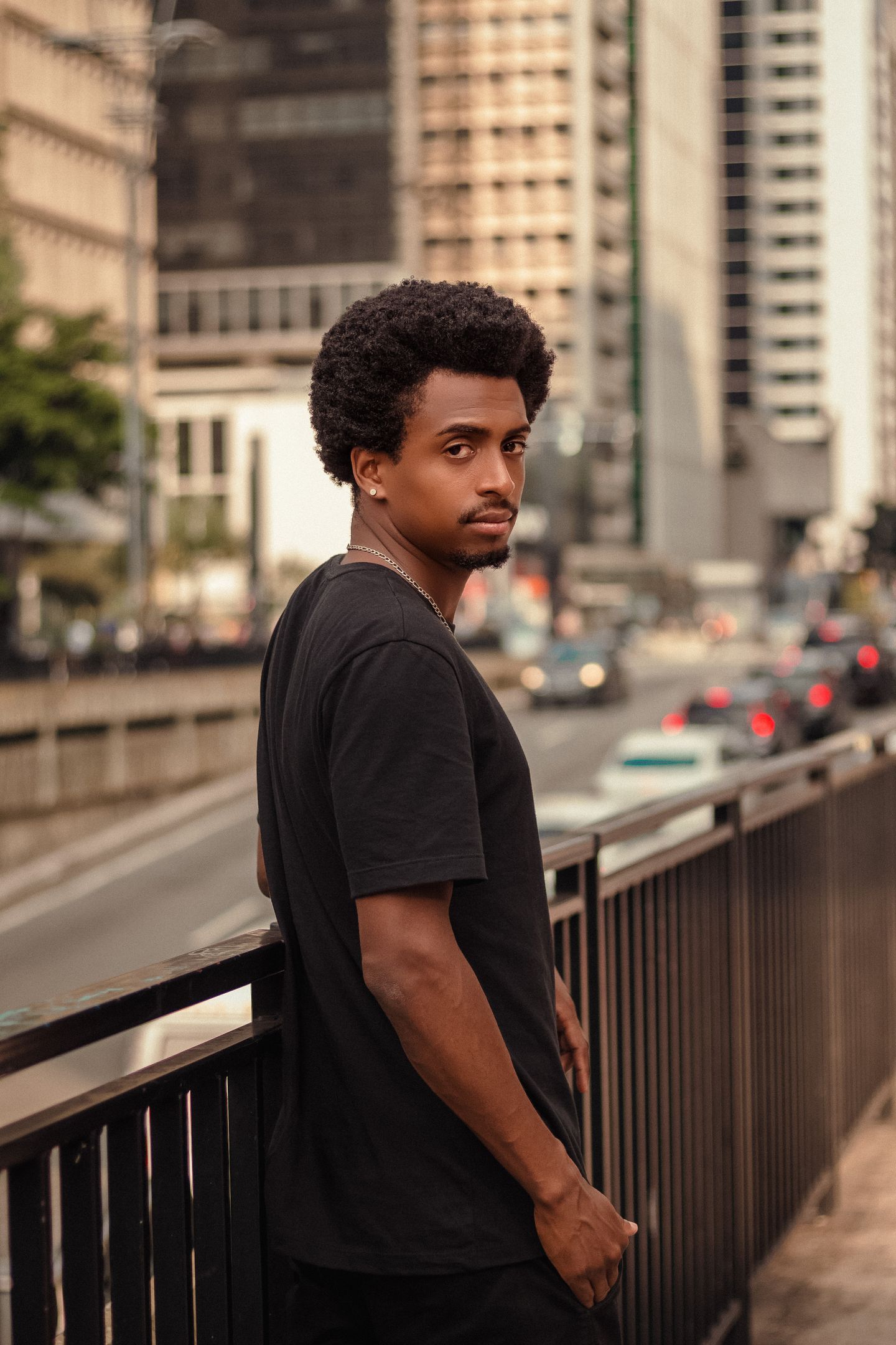 Editorial portrait of a Black male model in an urban setting