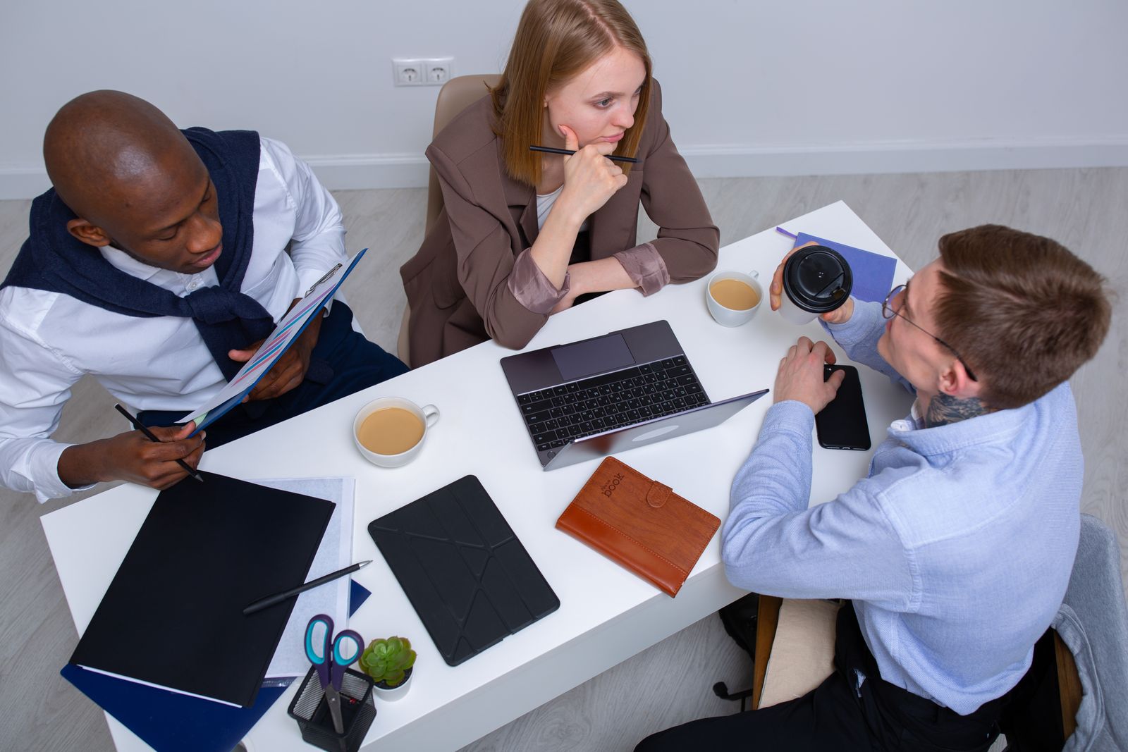 People collaborating around a meeting table