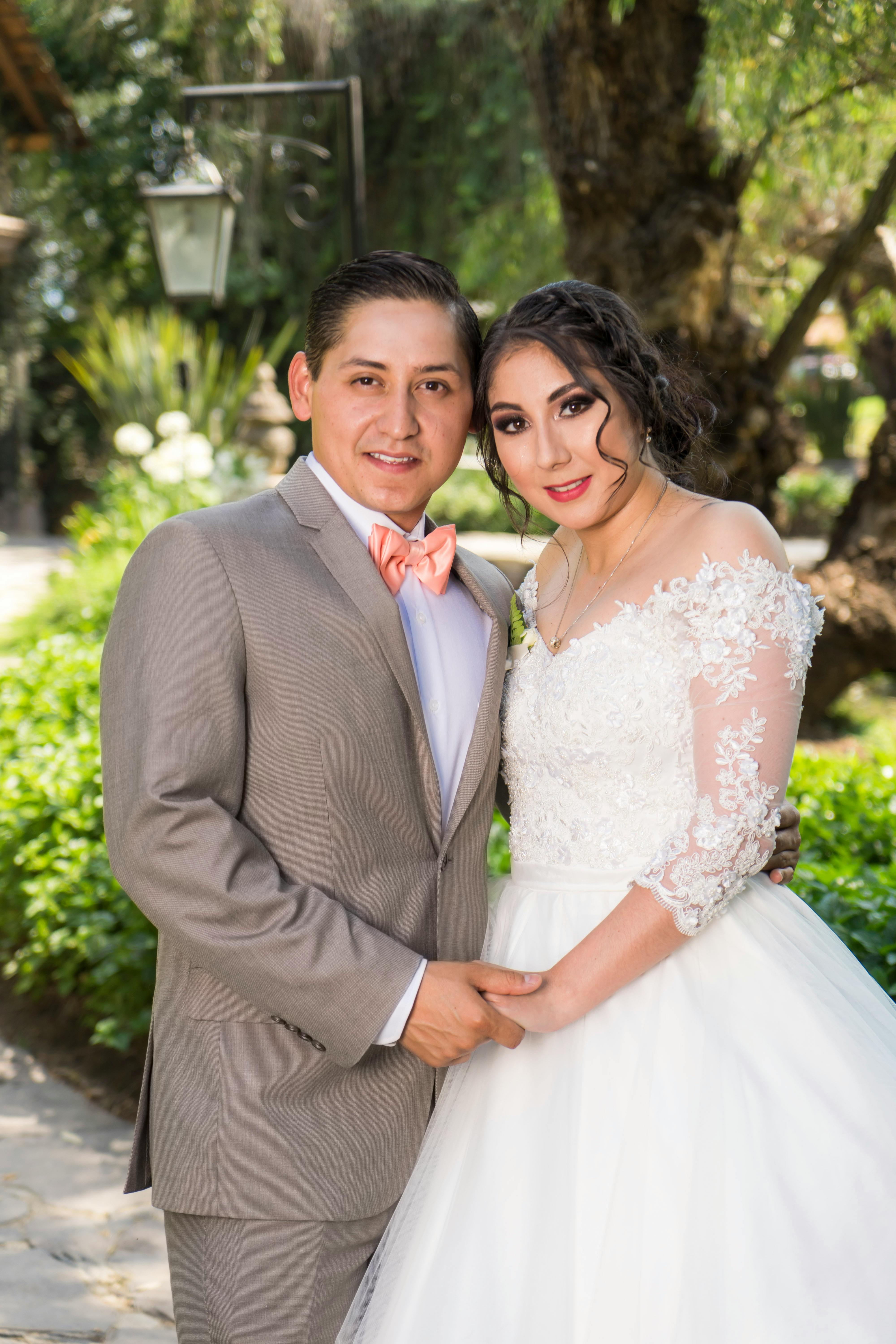 Man in Brown Suit Beside Woman in White Wedding Dress · Free Stock Photo
