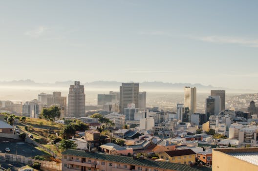 Stunning aerial view of Cape Town's skyline with clear skies and urban architecture.
